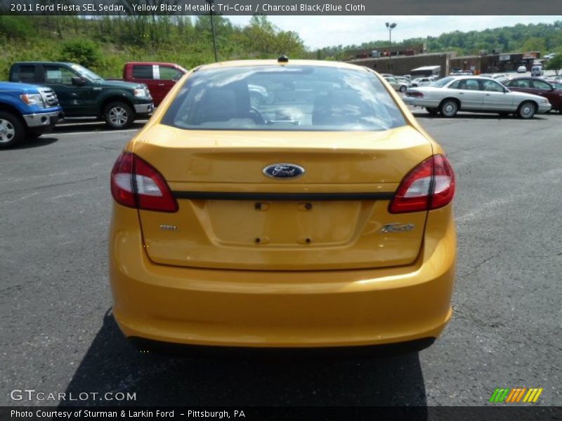 Yellow Blaze Metallic Tri-Coat / Charcoal Black/Blue Cloth 2011 Ford Fiesta SEL Sedan