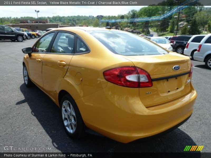 Yellow Blaze Metallic Tri-Coat / Charcoal Black/Blue Cloth 2011 Ford Fiesta SEL Sedan