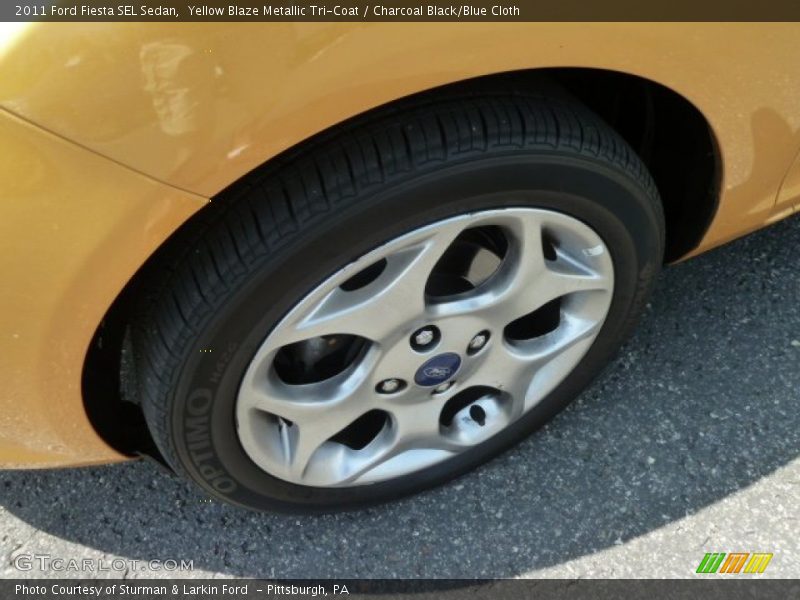 Yellow Blaze Metallic Tri-Coat / Charcoal Black/Blue Cloth 2011 Ford Fiesta SEL Sedan