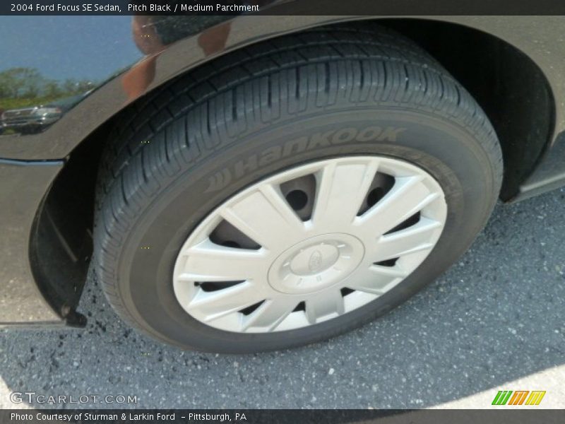 Pitch Black / Medium Parchment 2004 Ford Focus SE Sedan