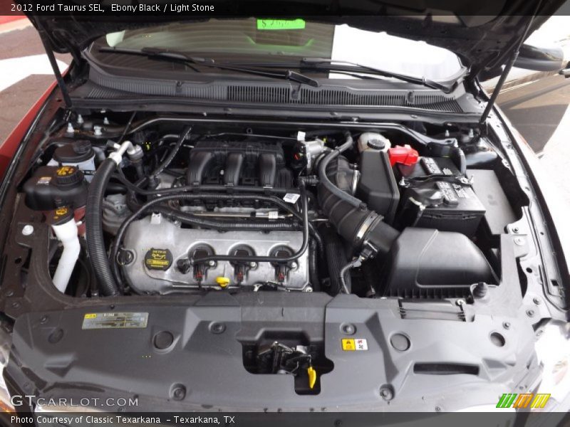 Ebony Black / Light Stone 2012 Ford Taurus SEL