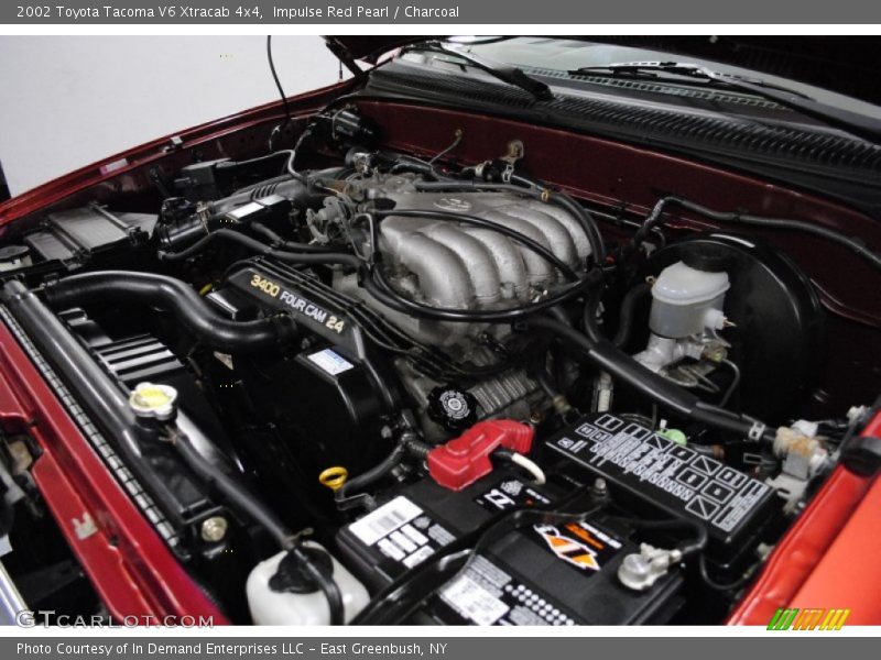 Impulse Red Pearl / Charcoal 2002 Toyota Tacoma V6 Xtracab 4x4