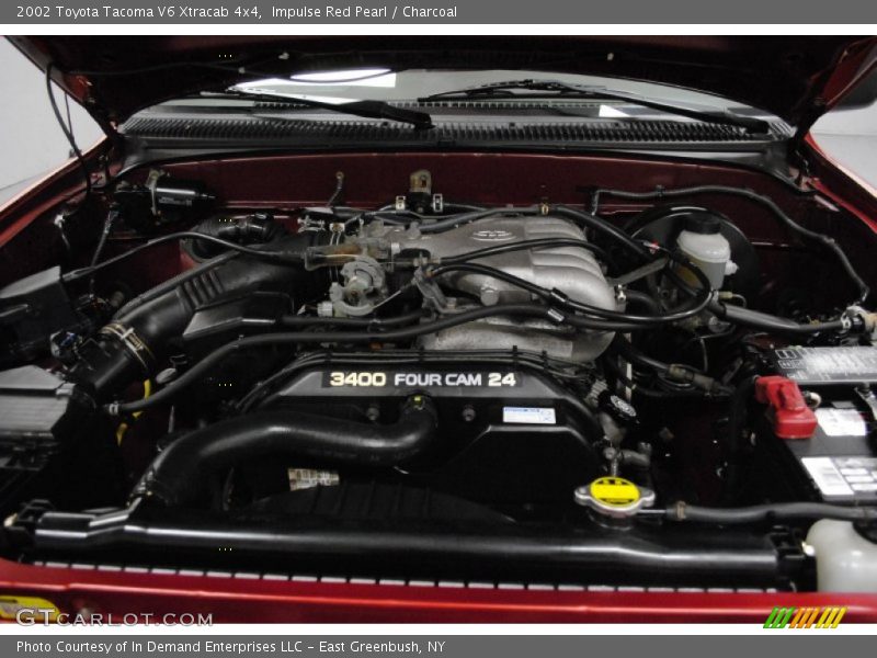 Impulse Red Pearl / Charcoal 2002 Toyota Tacoma V6 Xtracab 4x4