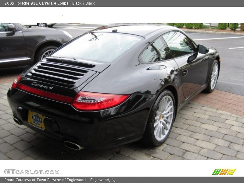 Black / Black 2009 Porsche 911 Carrera 4 Coupe