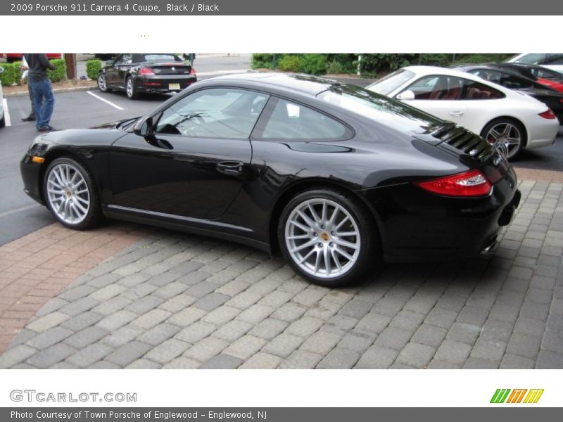 Black / Black 2009 Porsche 911 Carrera 4 Coupe