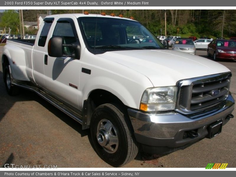 Front 3/4 View of 2003 F350 Super Duty XLT SuperCab 4x4 Dually