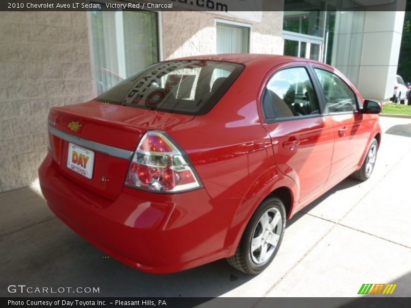 Victory Red / Charcoal 2010 Chevrolet Aveo LT Sedan