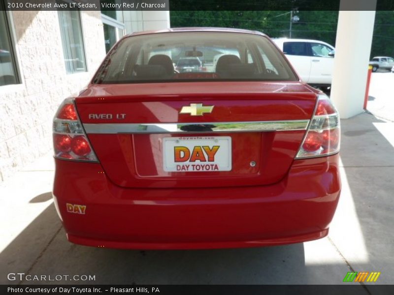 Victory Red / Charcoal 2010 Chevrolet Aveo LT Sedan