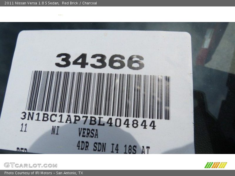 Red Brick / Charcoal 2011 Nissan Versa 1.8 S Sedan