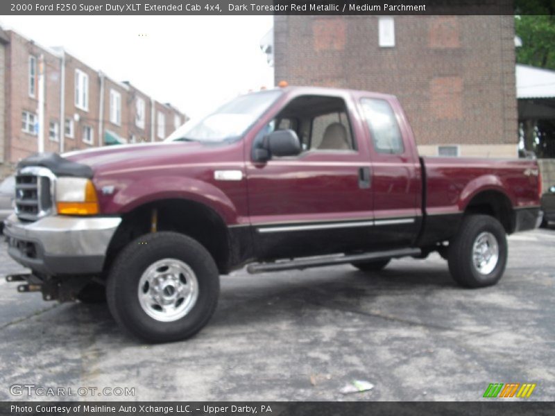 Dark Toreador Red Metallic / Medium Parchment 2000 Ford F250 Super Duty XLT Extended Cab 4x4