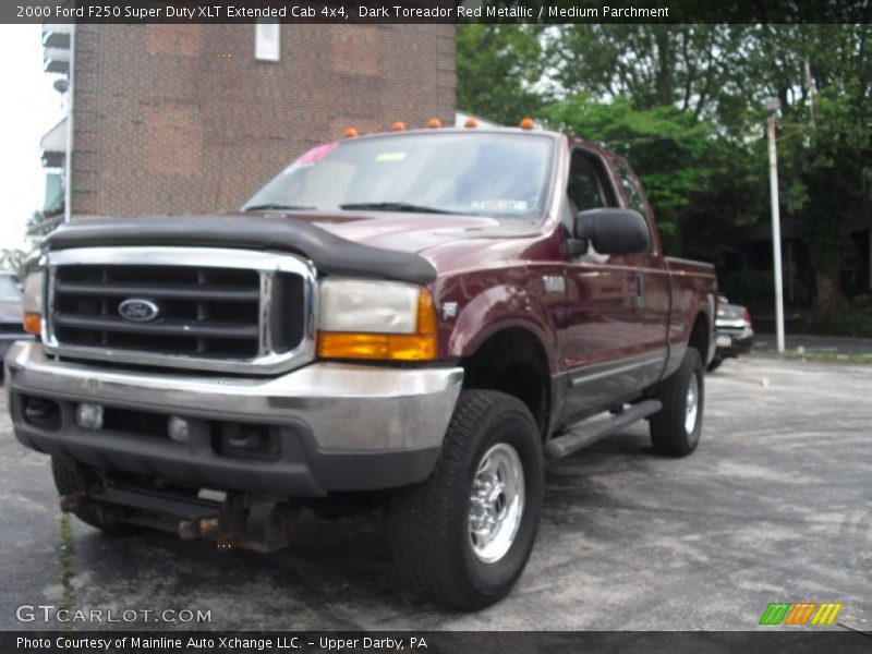 Dark Toreador Red Metallic / Medium Parchment 2000 Ford F250 Super Duty XLT Extended Cab 4x4