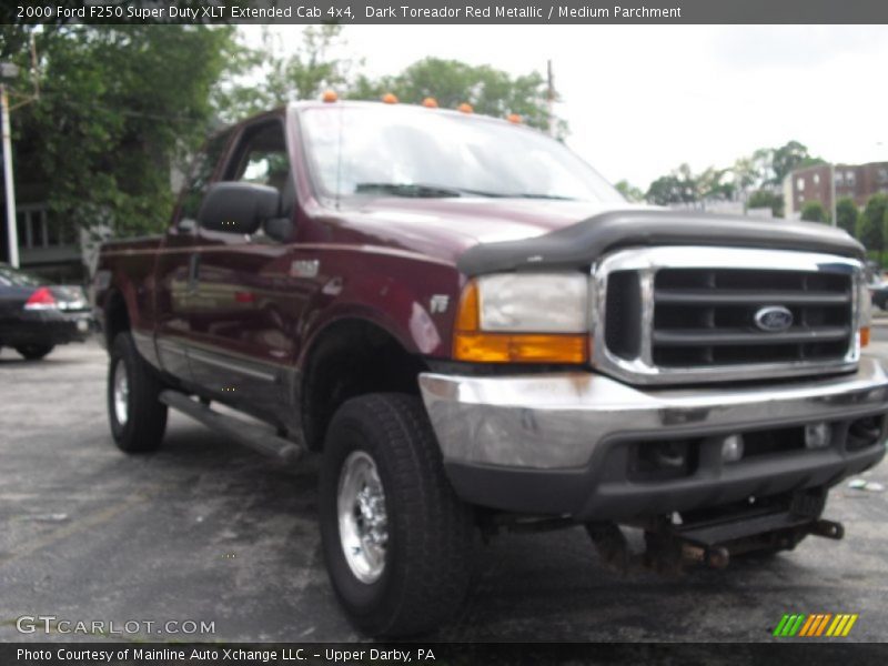 Dark Toreador Red Metallic / Medium Parchment 2000 Ford F250 Super Duty XLT Extended Cab 4x4