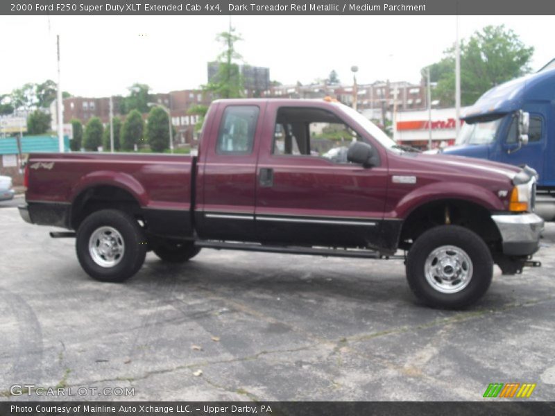 Dark Toreador Red Metallic / Medium Parchment 2000 Ford F250 Super Duty XLT Extended Cab 4x4