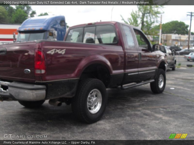 Dark Toreador Red Metallic / Medium Parchment 2000 Ford F250 Super Duty XLT Extended Cab 4x4