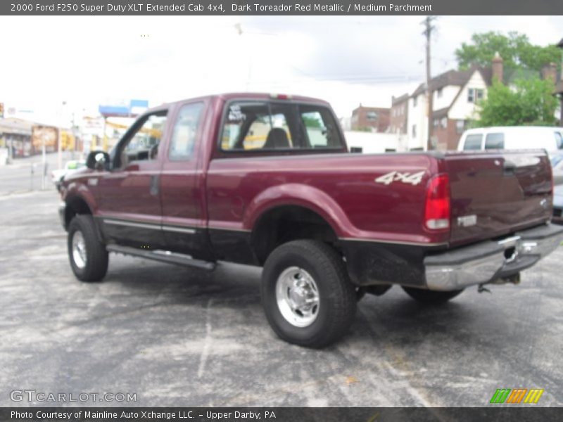 Dark Toreador Red Metallic / Medium Parchment 2000 Ford F250 Super Duty XLT Extended Cab 4x4