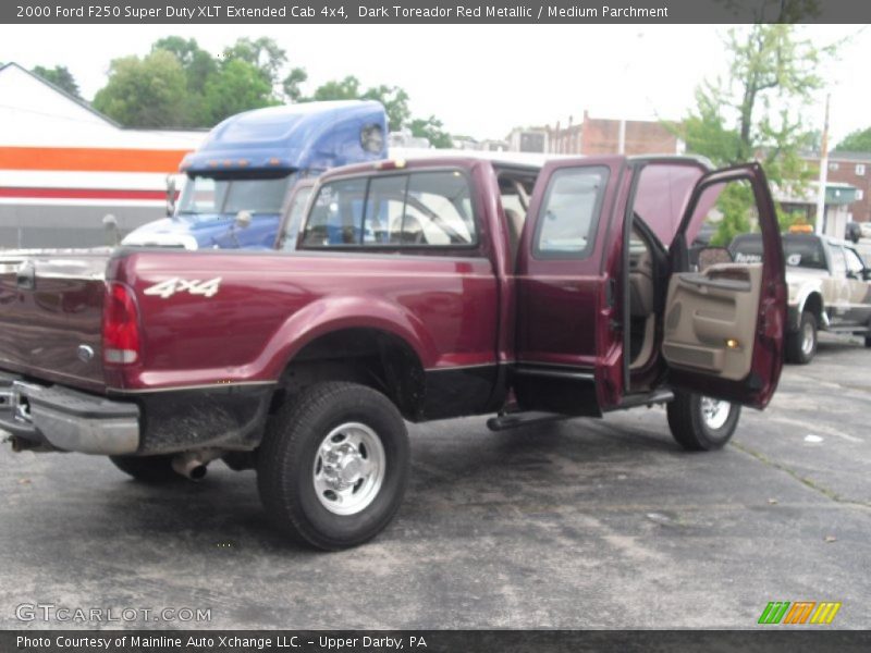 Dark Toreador Red Metallic / Medium Parchment 2000 Ford F250 Super Duty XLT Extended Cab 4x4
