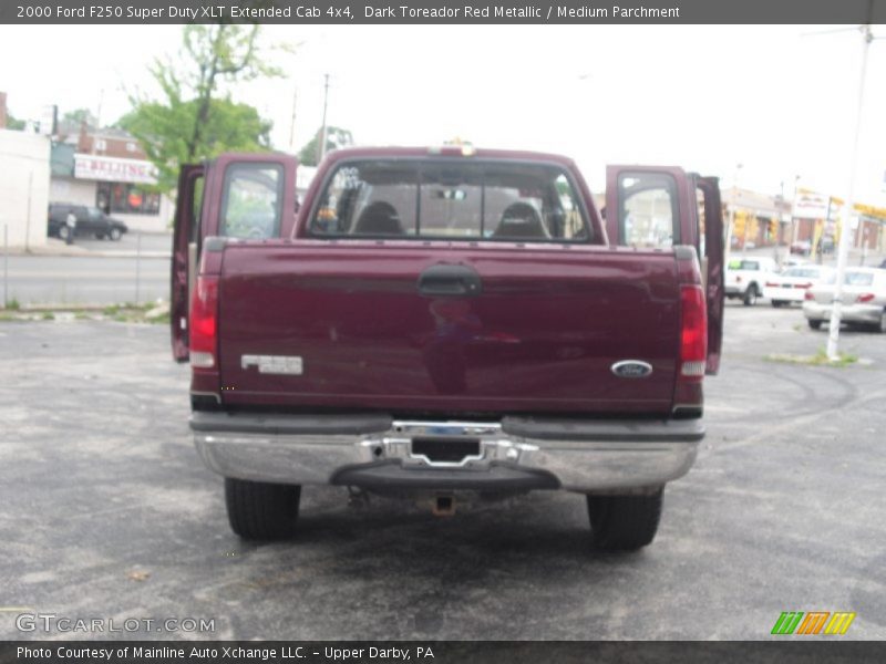 Dark Toreador Red Metallic / Medium Parchment 2000 Ford F250 Super Duty XLT Extended Cab 4x4