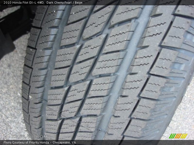 Dark Cherry Pearl / Beige 2010 Honda Pilot EX-L 4WD