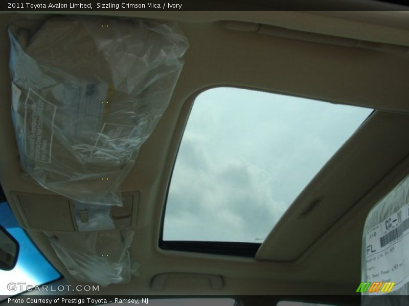 Sizzling Crimson Mica / Ivory 2011 Toyota Avalon Limited