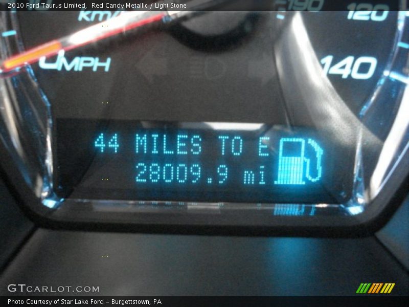 Red Candy Metallic / Light Stone 2010 Ford Taurus Limited