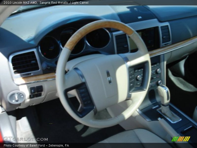 Sangria Red Metallic / Light Camel 2010 Lincoln MKZ AWD