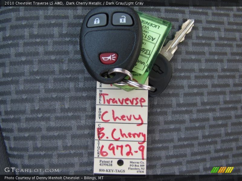 Dark Cherry Metallic / Dark Gray/Light Gray 2010 Chevrolet Traverse LS AWD