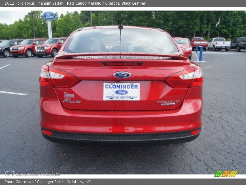Red Candy Metallic / Charcoal Black Leather 2012 Ford Focus Titanium Sedan