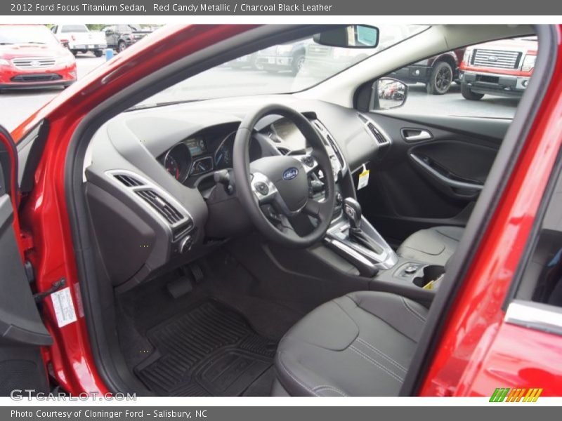 Red Candy Metallic / Charcoal Black Leather 2012 Ford Focus Titanium Sedan
