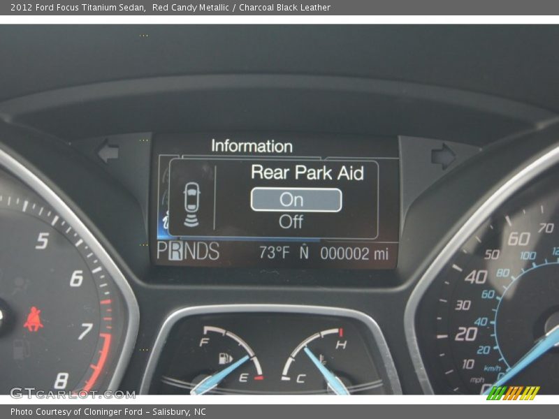 Red Candy Metallic / Charcoal Black Leather 2012 Ford Focus Titanium Sedan