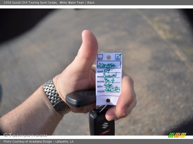 White Water Pearl / Black 2009 Suzuki SX4 Touring Sport Sedan