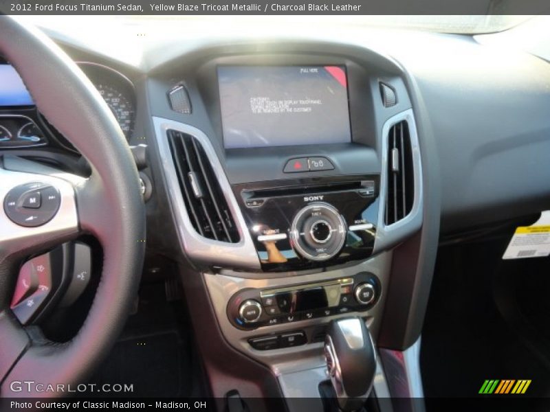 Yellow Blaze Tricoat Metallic / Charcoal Black Leather 2012 Ford Focus Titanium Sedan