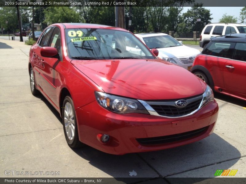 Lightning Red / Carbon Black 2009 Subaru Impreza 2.5i Premium Sedan