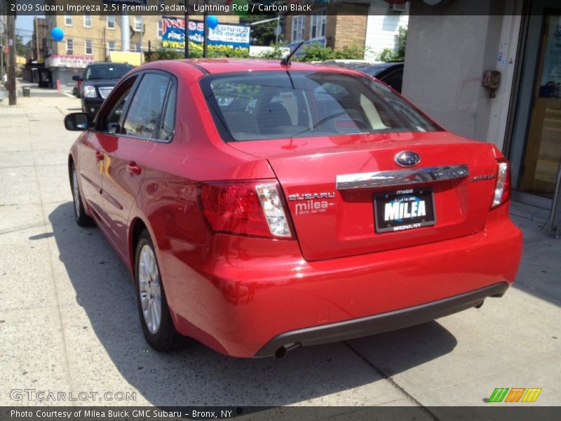 Lightning Red / Carbon Black 2009 Subaru Impreza 2.5i Premium Sedan