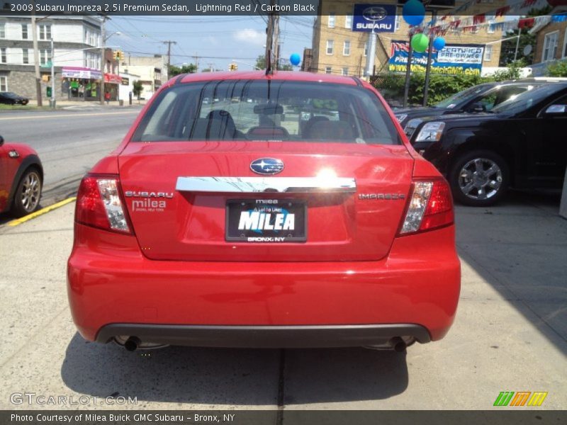 Lightning Red / Carbon Black 2009 Subaru Impreza 2.5i Premium Sedan
