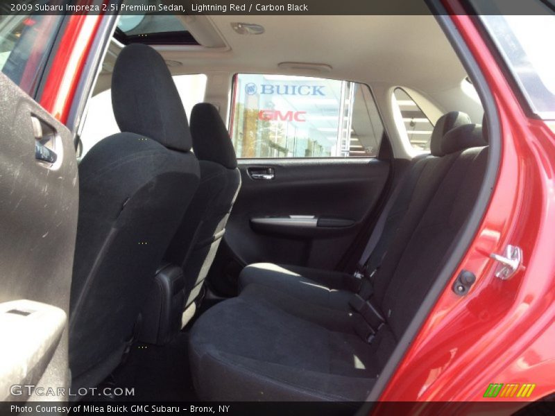 Lightning Red / Carbon Black 2009 Subaru Impreza 2.5i Premium Sedan