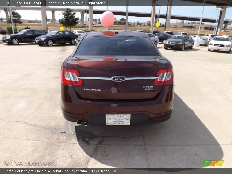 Cinnamon Red Metallic / Light Stone 2010 Ford Taurus SEL
