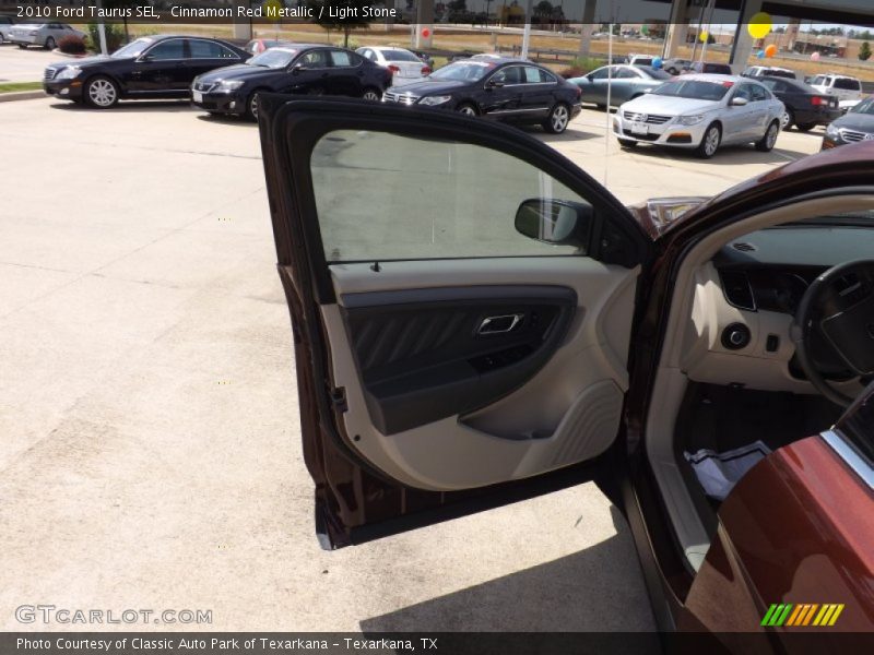 Cinnamon Red Metallic / Light Stone 2010 Ford Taurus SEL