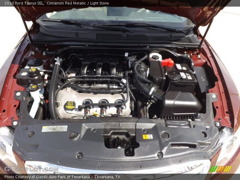 Cinnamon Red Metallic / Light Stone 2010 Ford Taurus SEL