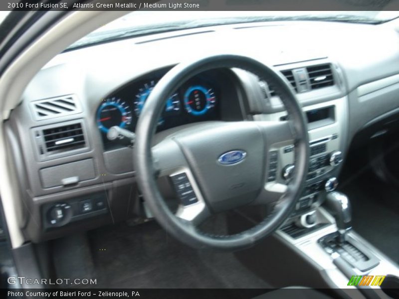 Atlantis Green Metallic / Medium Light Stone 2010 Ford Fusion SE