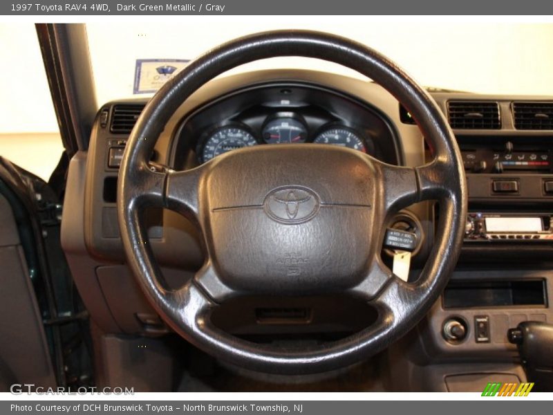 Dark Green Metallic / Gray 1997 Toyota RAV4 4WD