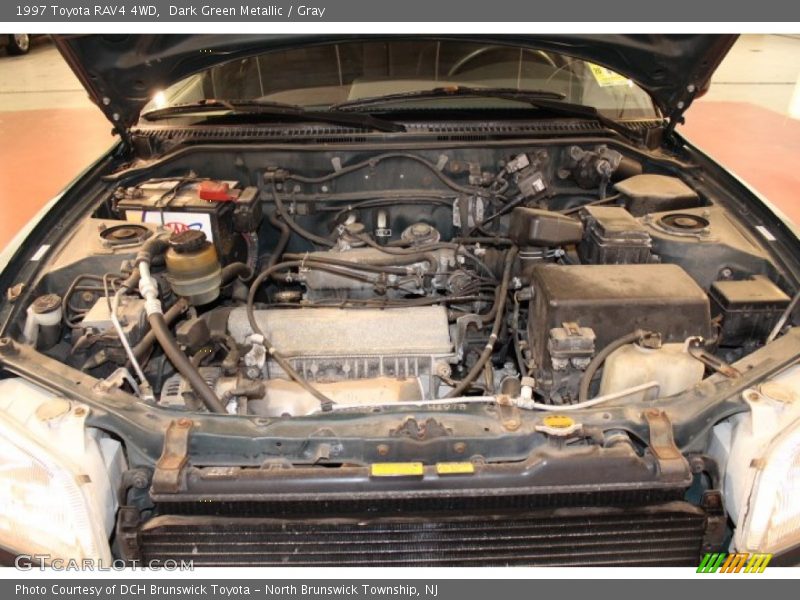Dark Green Metallic / Gray 1997 Toyota RAV4 4WD