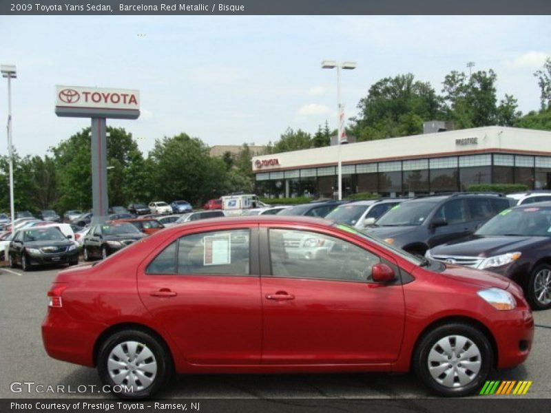 Barcelona Red Metallic / Bisque 2009 Toyota Yaris Sedan