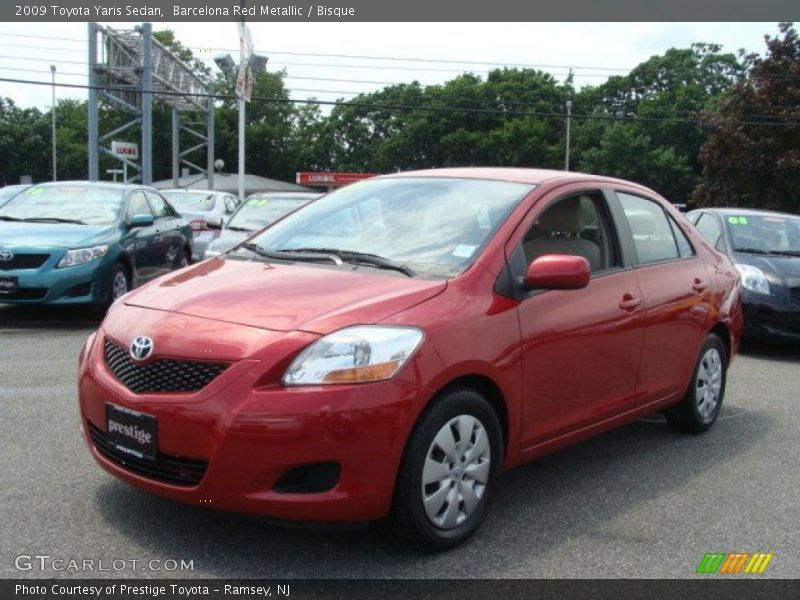 Barcelona Red Metallic / Bisque 2009 Toyota Yaris Sedan
