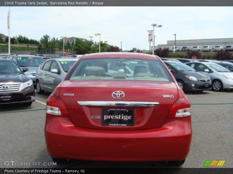 Barcelona Red Metallic / Bisque 2009 Toyota Yaris Sedan
