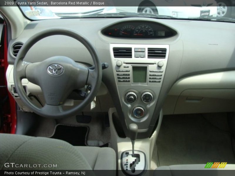 Barcelona Red Metallic / Bisque 2009 Toyota Yaris Sedan