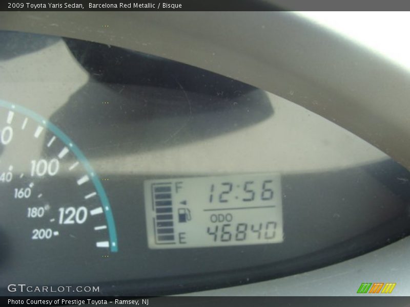 Barcelona Red Metallic / Bisque 2009 Toyota Yaris Sedan