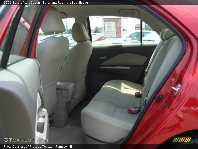 Barcelona Red Metallic / Bisque 2009 Toyota Yaris Sedan
