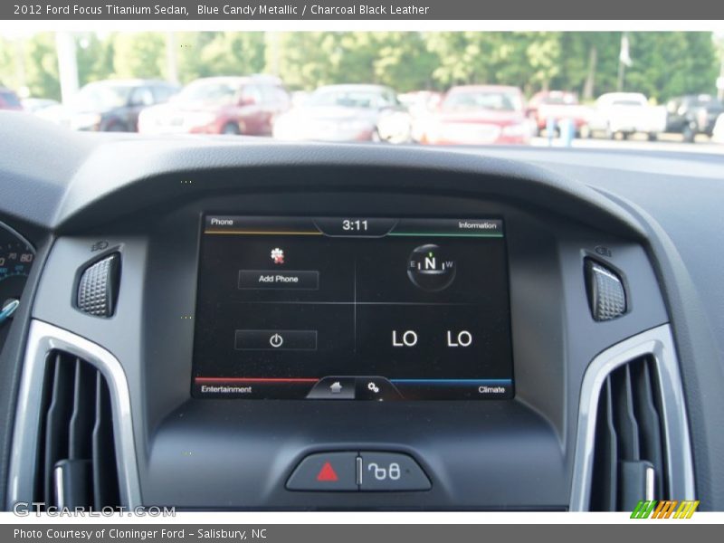 Blue Candy Metallic / Charcoal Black Leather 2012 Ford Focus Titanium Sedan