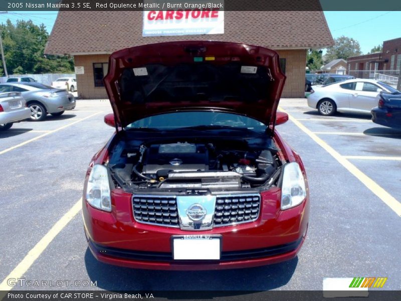 Red Opulence Metallic / Burnt Orange/Black 2005 Nissan Maxima 3.5 SE