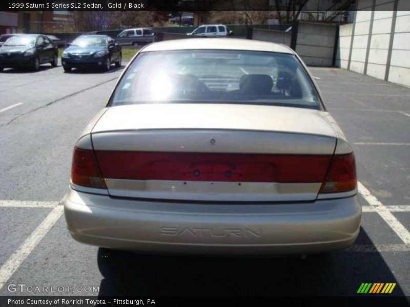 Gold / Black 1999 Saturn S Series SL2 Sedan